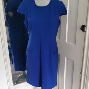 Attitude royal blue shift sleevelessdress with frontpockets.Midi length. Size 14